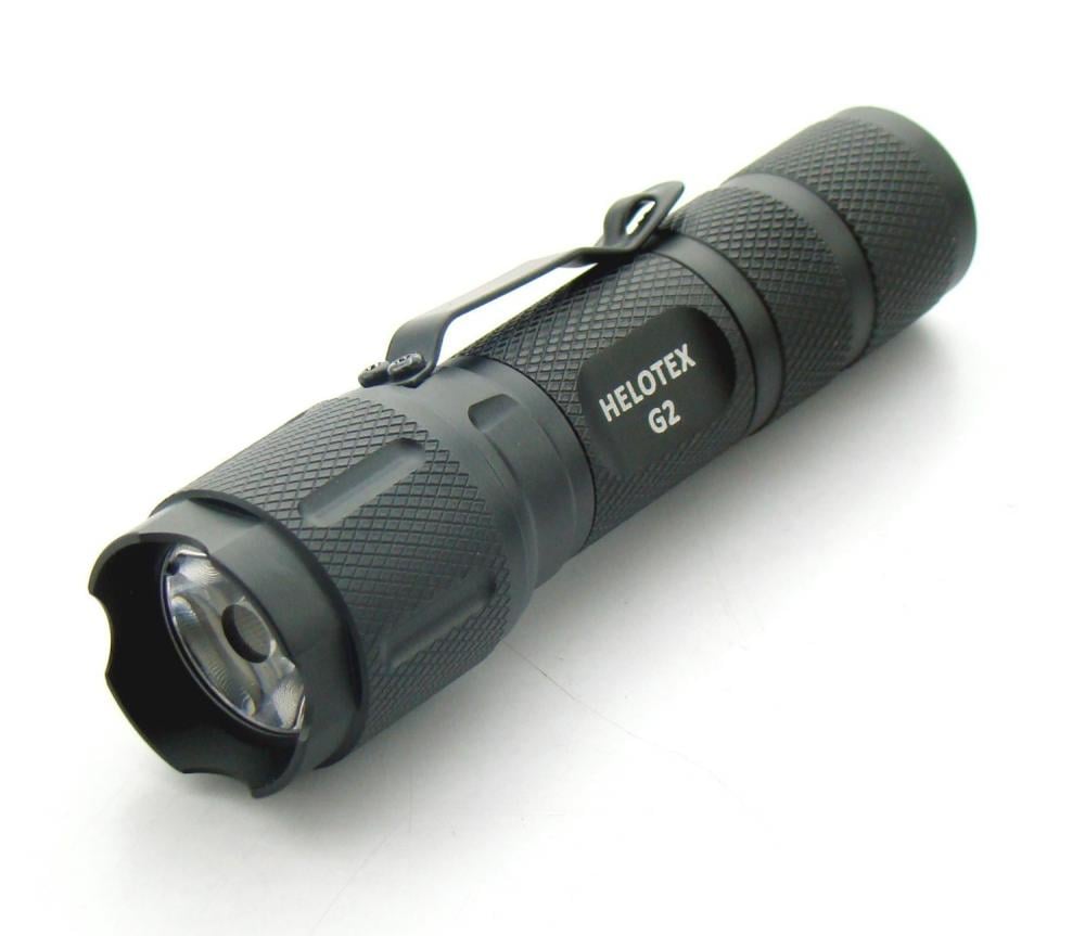The flashlight features a tactile click on/off button on the rear of the fl...
